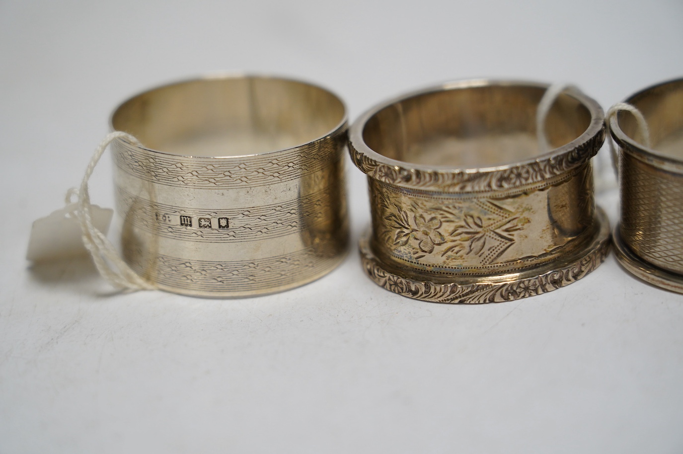 A collection of fifteen assorted early 20th century and later silver napkin rings, various dates and makers. Condition - poor to fair